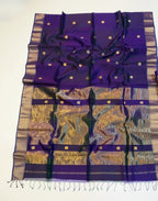 Purple and gold saree with a decorative basket on a white background
