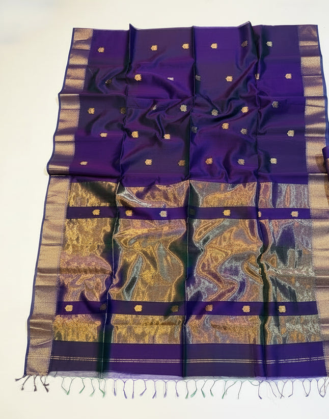 Purple and gold saree with a decorative basket on a white background
