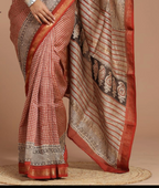 Traditional saree with intricate patterns on a beige background