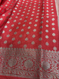 Red fabric with silver floral patterns