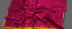 Saree with a red and gold pattern on a white background