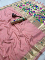 Pink saree with floral patterns on a plain background