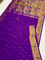 Purple saree with a gold border and patterns on a white background