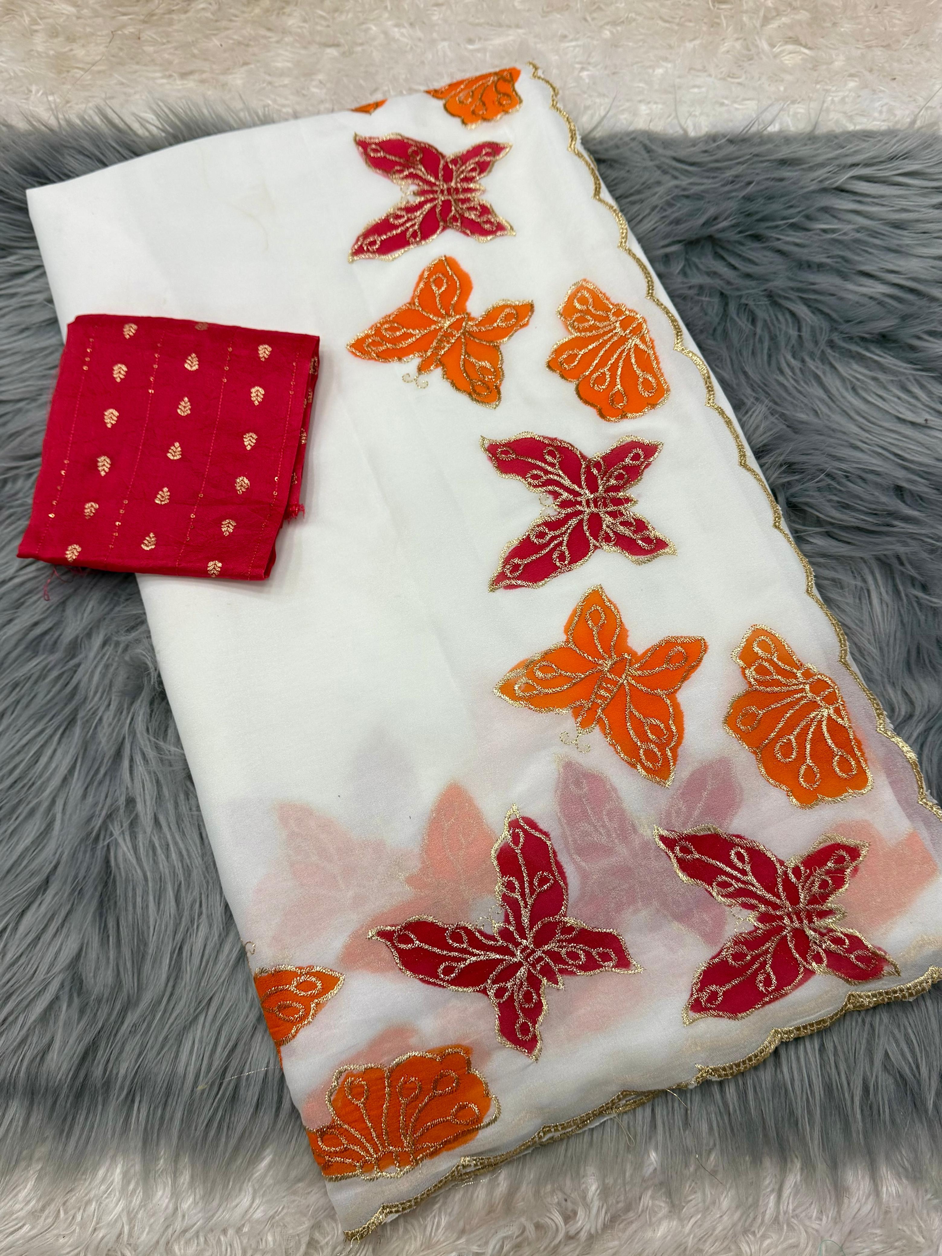 White fabric with red and orange butterfly patterns on a gray textured surface
