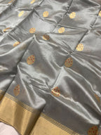 Gray fabric with gold patterns and border