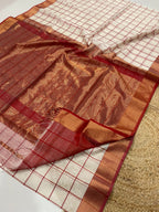 White & Red checkered fabric with a grid pattern on a white surface