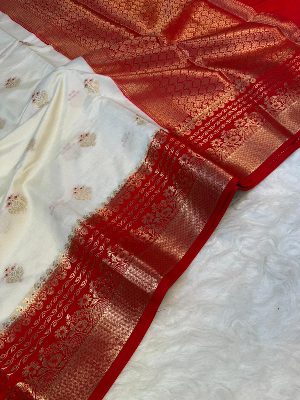 White fabric with red and gold patterned border