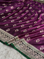 Purple saree with intricate white patterns on a white background
