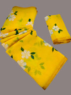 Yellow fabric with floral patterns on a gray background