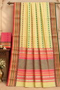 Premium yellow cotton saree with multicoloured vertical motifs, pink and green decorative borders, a contrasting pink striped pallu and matching blouse piece.