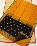 Yellow and black saree with a floral pattern on a white background