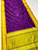 Purple saree with yellow border on a white background