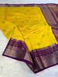 Yellow saree with purple border on a white background