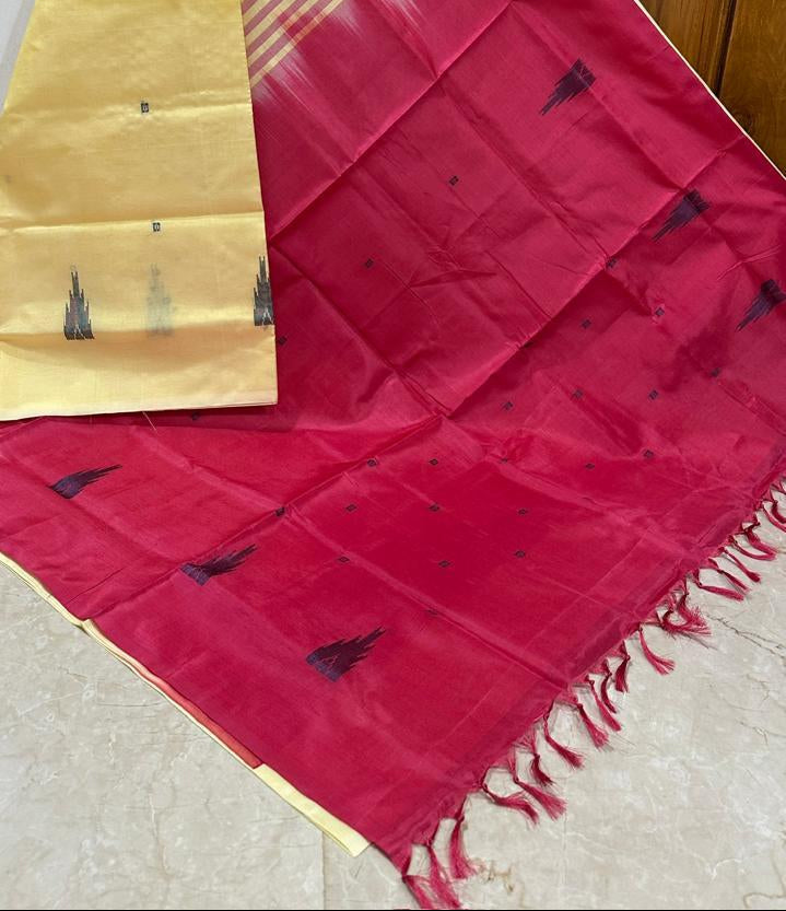 A yellow and red gradient saree with small black motifs and fringed edges, draped against a wooden door background. The number '998' is printed on the image.