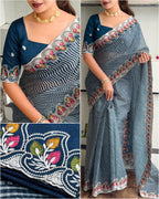 Woman wearing a blue saree with floral patterns, close-up of saree design, and full view of saree.