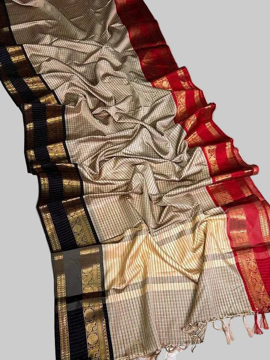 Saree with black, gold, and red patterns on a light background