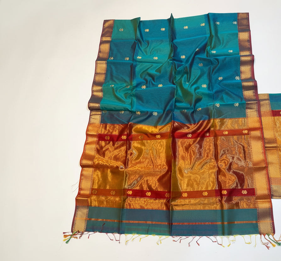 Traditional saree with blue and orange patterns on a white background