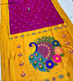 Yellow saree with purple blouse featuring peacock and floral designs.