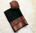 Black saree with maroon border and floral decorations on a white background
