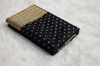 Black fabric with gold embroidery on a white surface, branded 'LIRA'.