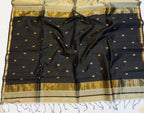 Black and beige saree with a basket of flowers on a white background