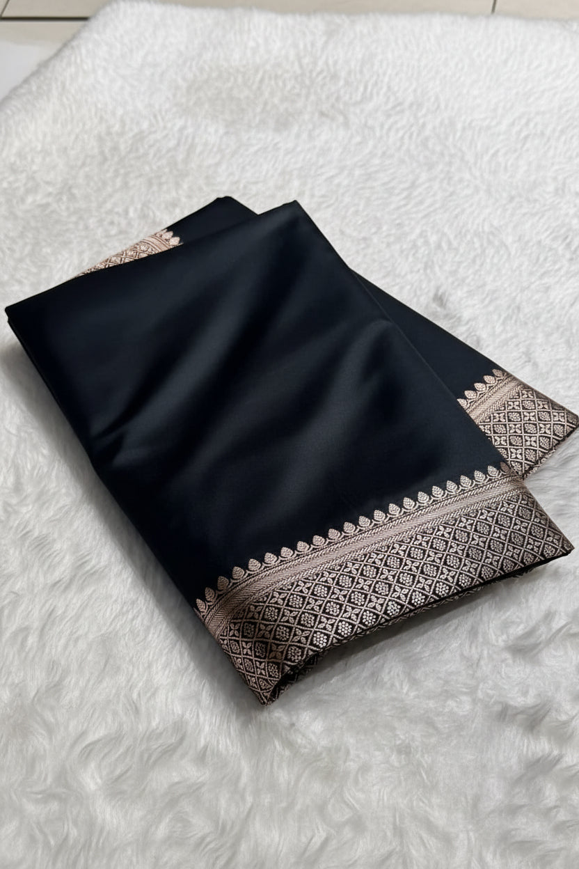 Black scarf with intricate patterns on a white surface, branded 'Zara'.