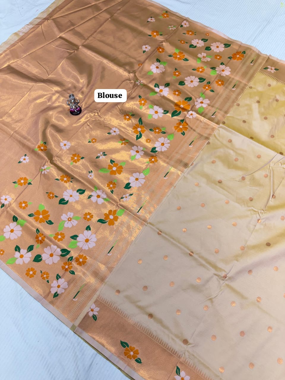 Two fabric samples with floral patterns on a light blue background