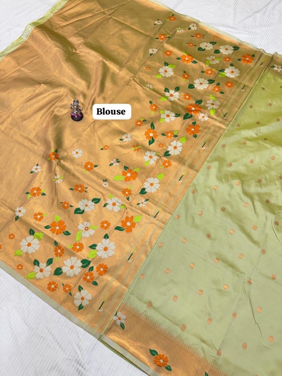 Saree with floral patterns on a plain background