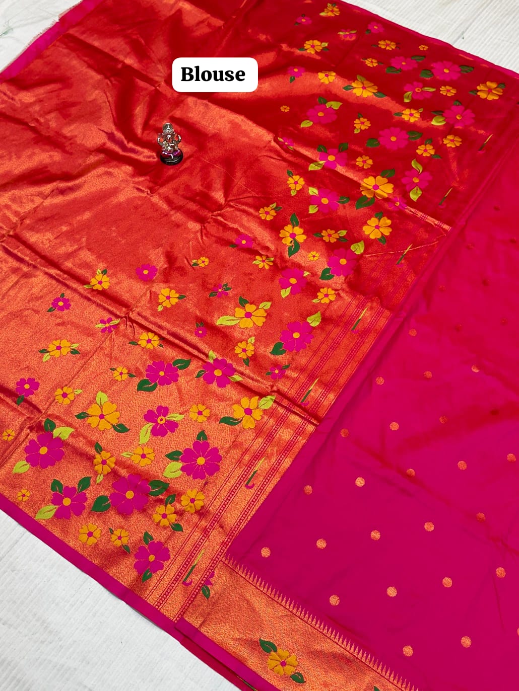 Red blouse with floral patterns on a white background