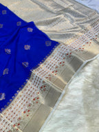 Blue fabric with intricate patterns on a textured surface
