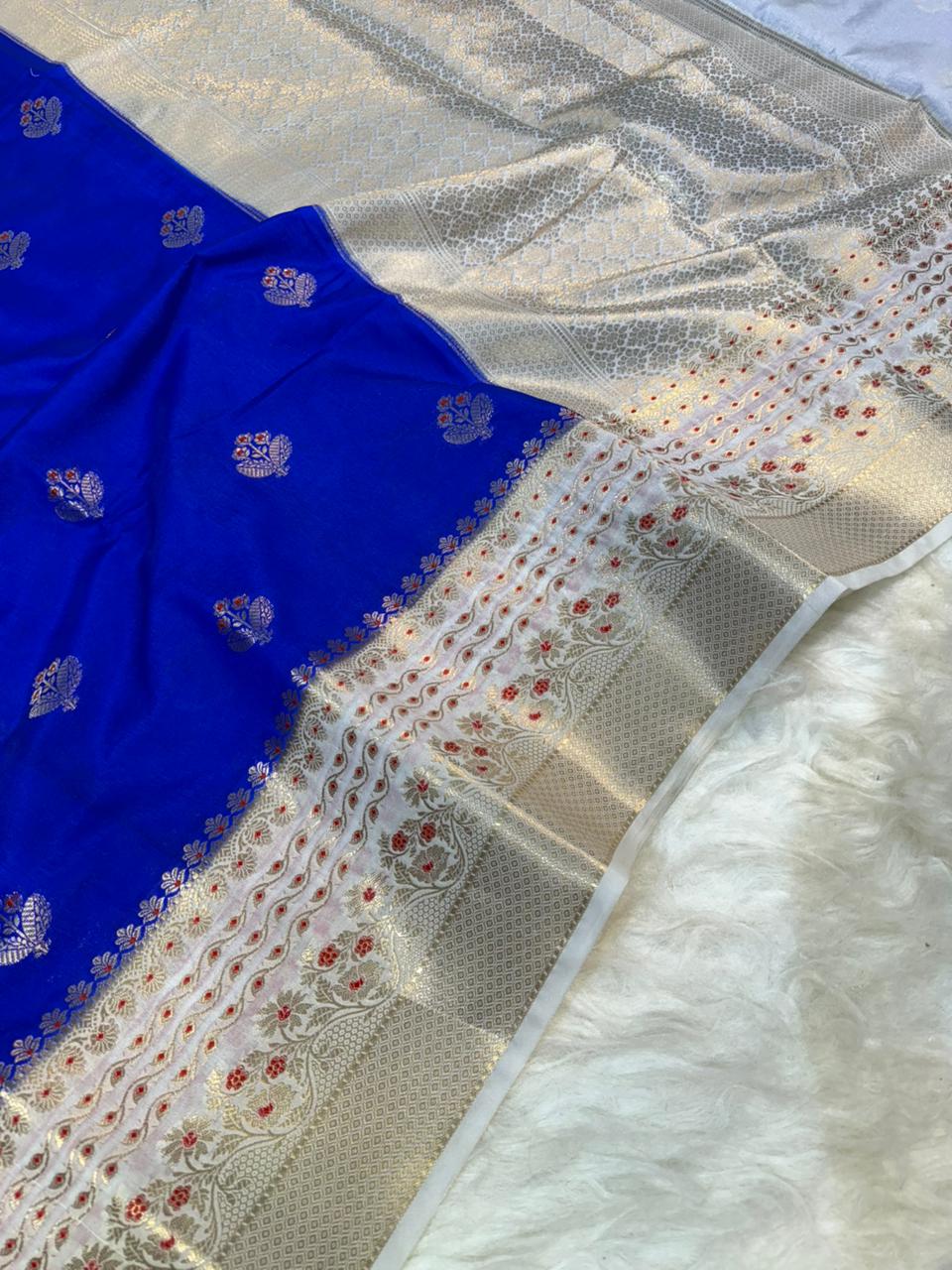 Blue fabric with intricate patterns on a textured surface