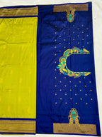 Blue and yellow saree with intricate gold and green patterns on a white background
