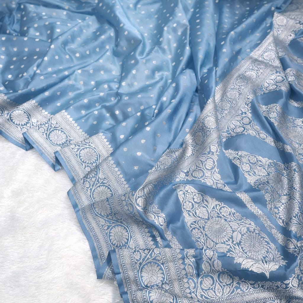 Blue fabric with white patterns on a white background