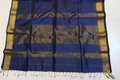 Blue and gold patterned fabric with fringes on a white background
