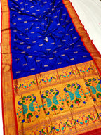 Blue and orange saree with peacock patterns on a white background