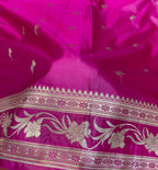 Close-up of a pink fabric with gold embroidery