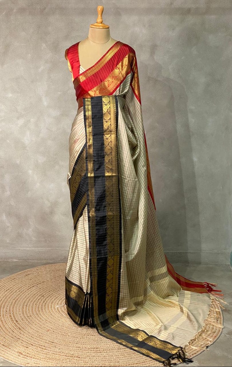 Saree with a geometric pattern on a mannequin against a gray background