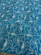 Blue fabric with white floral pattern