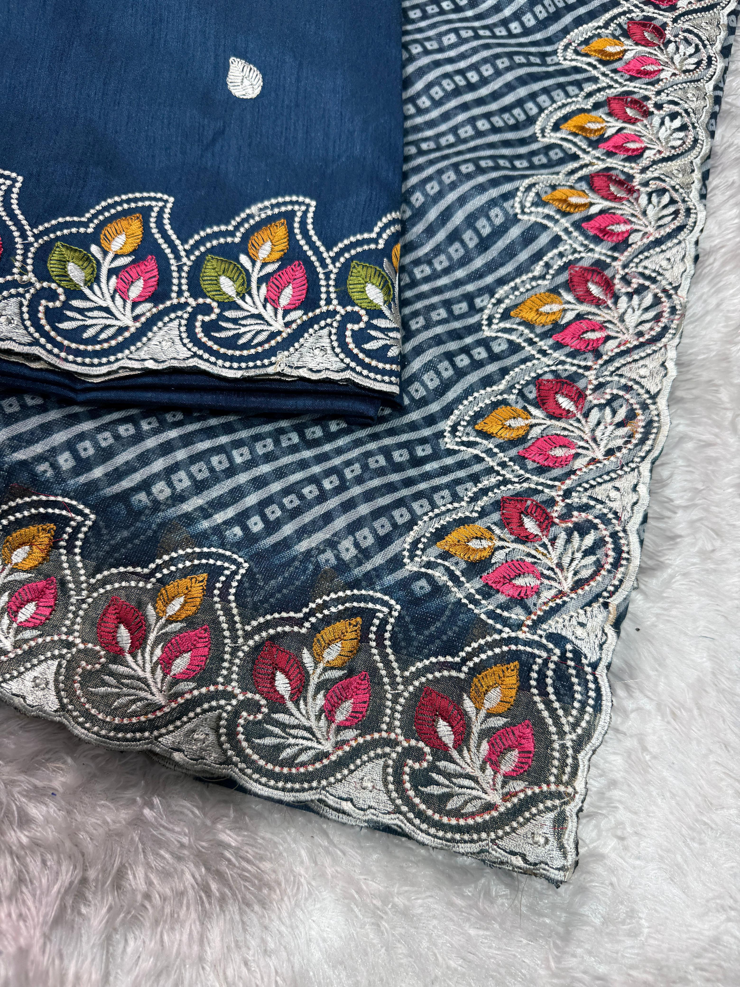 Decorative pillow with intricate floral embroidery on a soft surface