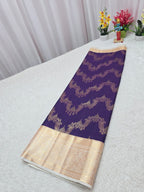 Purple saree with gold border on a white surface