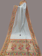 Decorative fabric with intricate patterns in a store setting