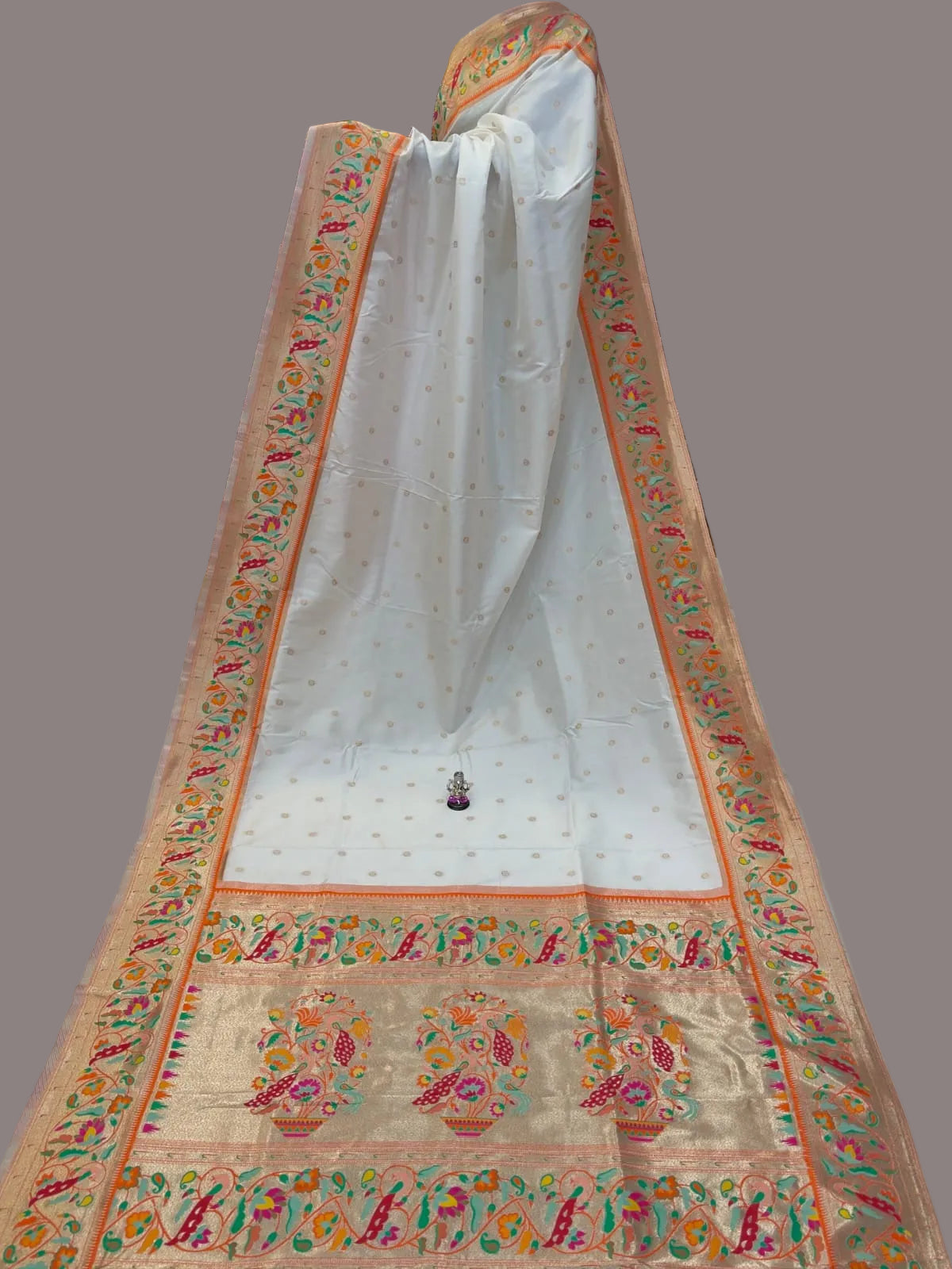 Decorative fabric with intricate patterns in a store setting