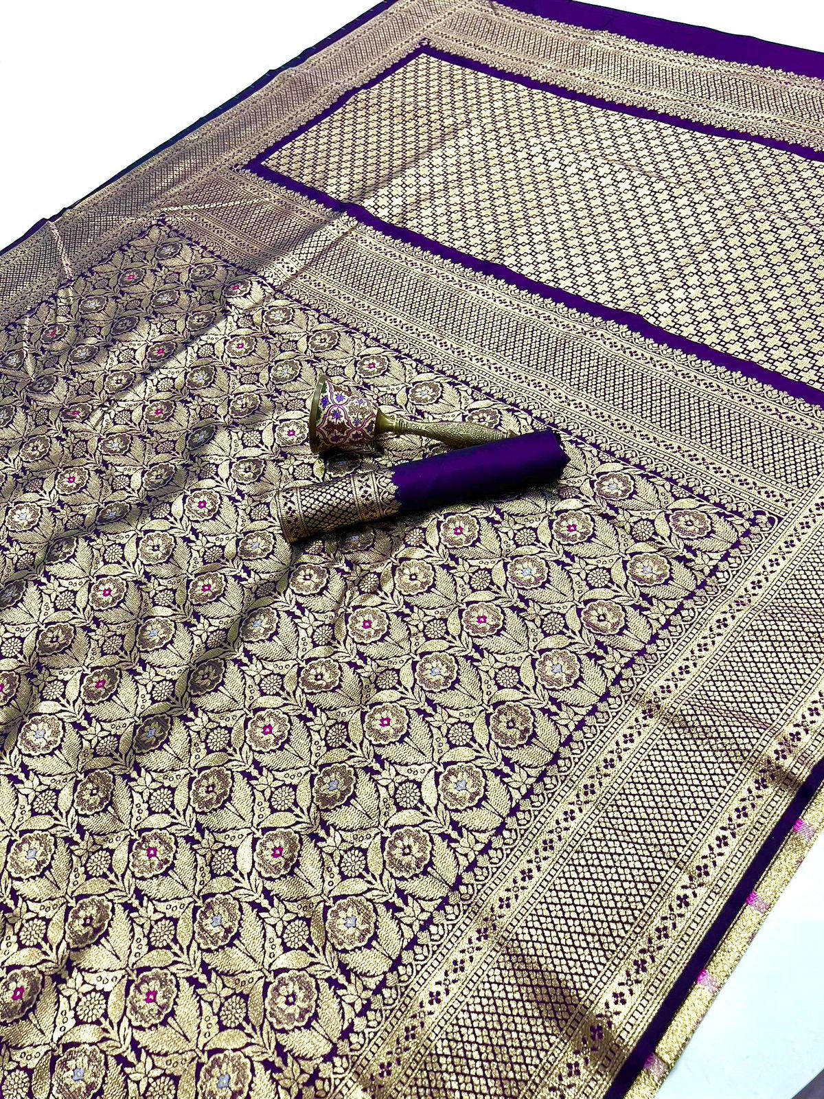 Decorative fabric with intricate patterns and a rolled-up item on a matching background