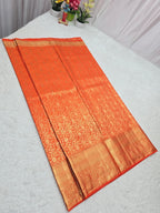 Orange saree with a pattern on a white background