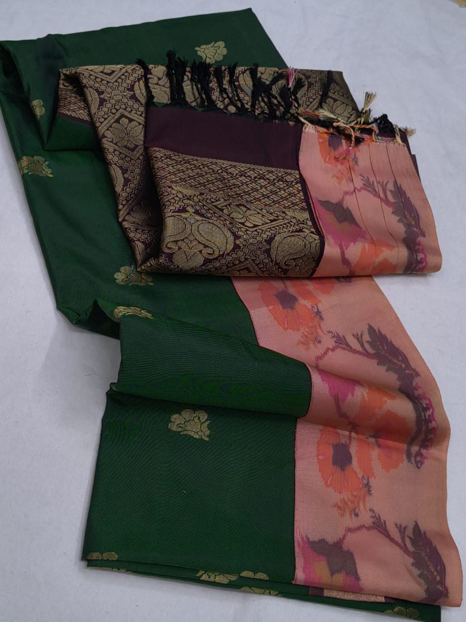 Two patterned scarves, one green and one with floral design, on a white background.