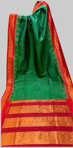 Green and orange saree with a grid pattern on a white background