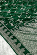 Green fabric with silver floral patterns