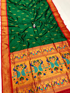 Green and orange saree with peacock patterns on a white background
