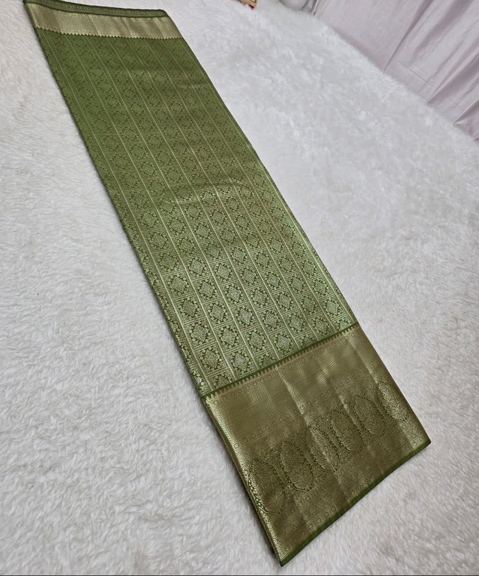 Green textured mat on a white surface with decorative items in the background