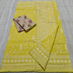 Yellow fabric with white floral patterns on a gray surface